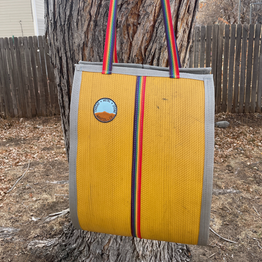 Repurposed Fire Hose Log Carrier