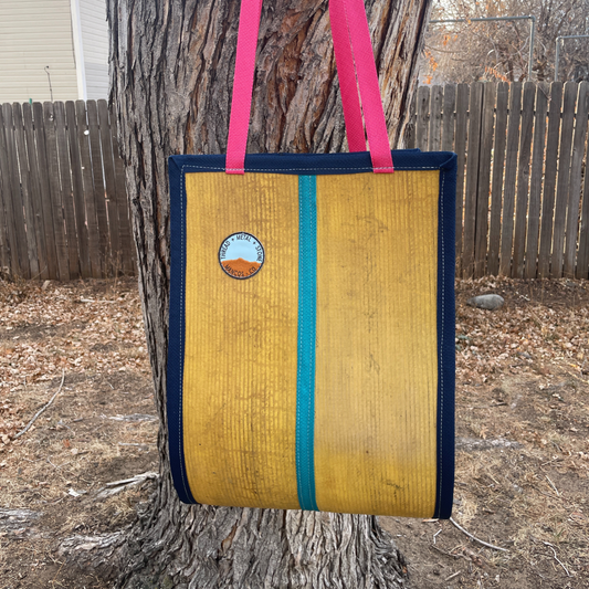 Repurposed Fire Hose Log Carrier